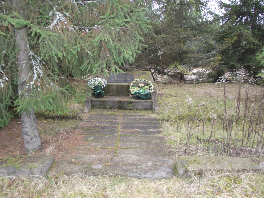 Commemorative sign at the murder site of Krymno's ghetto inmates